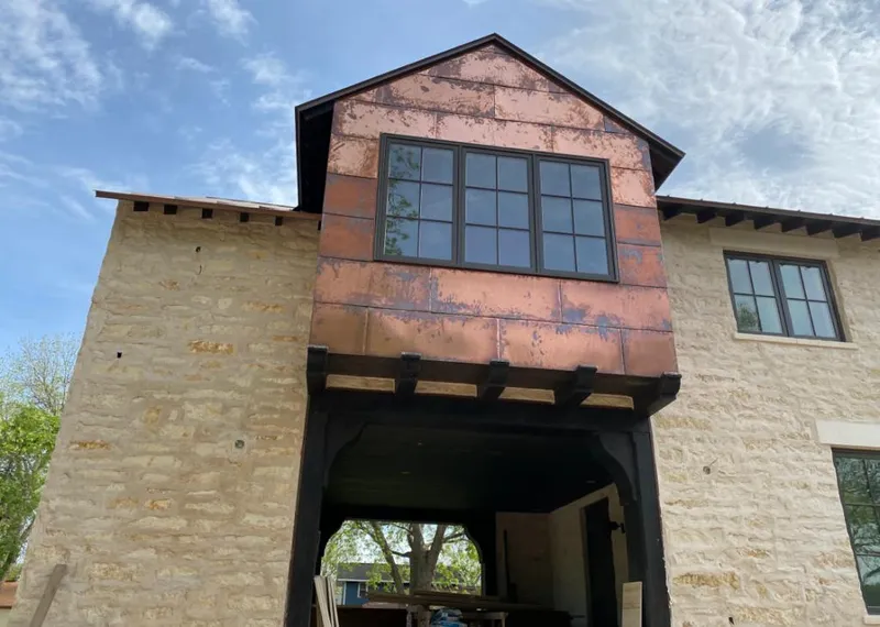 Copper metal panel facade on a stone building for Metal Roof Coating in Mount Airy