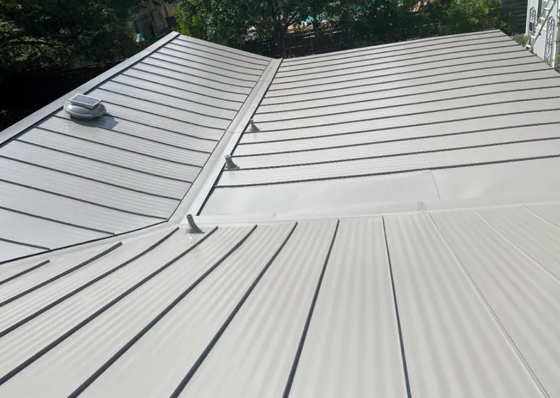 Solar attic fan installed on a metal roof for Roof Ventilation in Mount Airy